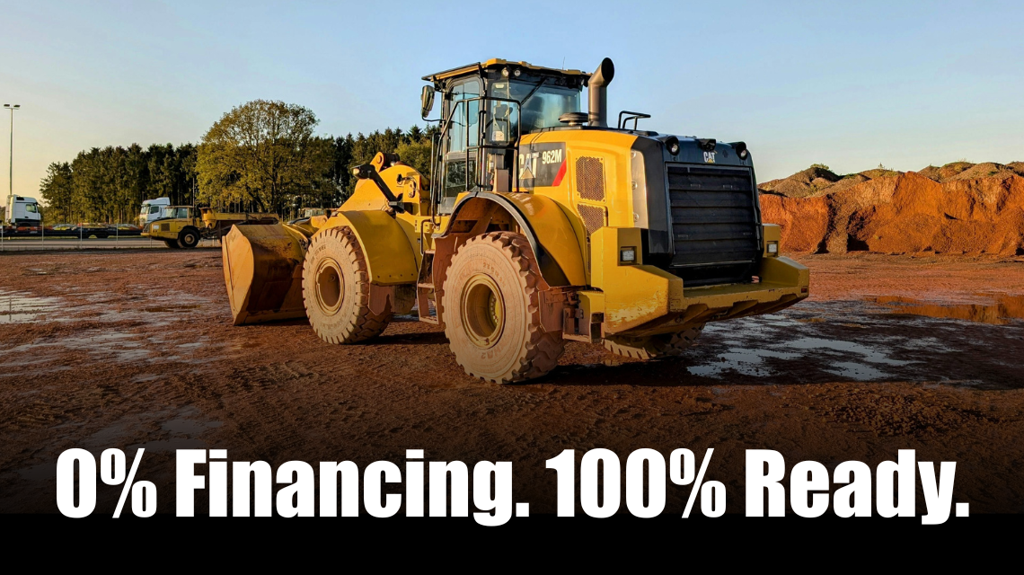 Cat backhoe working at a construction site with text stating 0% Financing. 100% Ready.