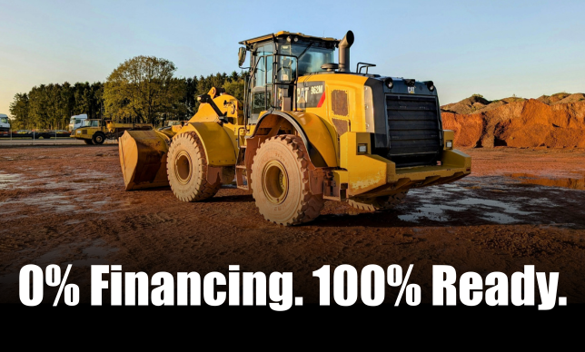 Cat backhoe working at a construction site with text stating 0% Financing. 100% Ready.